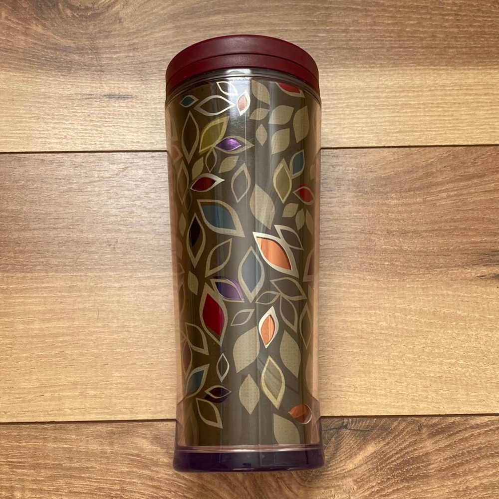 Starbucks khaki and earth tone tumbler thermos.